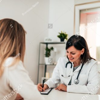 stock-photo-beautiful-female-doctor-filling-out-a-form-for-her-patient-1235331367